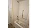 Shower stall with safety bar and updated shower head at 3318 Oakwood S Blvd, Sarasota, FL 34237