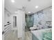 Modern bathroom with marble accents, glass shower, and organized closet space for a luxurious feel at 3320 Gulf Of Mexico Dr # 208C, Longboat Key, FL 34228