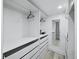 Organized walk-in closet with ample storage space featuring drawers, shelves, and hanging rods at 3320 Gulf Of Mexico Dr # 208C, Longboat Key, FL 34228