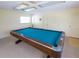 This game room features a well-lit interior, a full-size pool table, and neutral carpet at 3320 Gulf Of Mexico Dr # 208C, Longboat Key, FL 34228