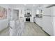 Well-equipped kitchen offers a large island, stainless steel appliances, and ample counter space at 3320 Gulf Of Mexico Dr # 208C, Longboat Key, FL 34228