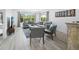 Bright living room features comfortable seating, large windows, and stylish decor at 3320 Gulf Of Mexico Dr # 208C, Longboat Key, FL 34228