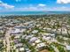 See the home in its neighborhood from an aerial view, near businesses with beach access and Gulf views at 340 Avenida De Mayo, Sarasota, FL 34242