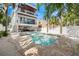 Stunning backyard showcasing a pool, spa, outdoor living area, and meticulous landscaping at 340 Avenida De Mayo, Sarasota, FL 34242