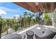 Spacious balcony with outdoor seating, a spiral staircase, and panoramic views at 340 Avenida De Mayo, Sarasota, FL 34242