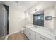 Modern bathroom featuring a blue tiled shower, white vanity, and a large mirror at 340 Avenida De Mayo, Sarasota, FL 34242