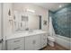 Well-lit bathroom featuring a tiled shower-tub combo and a white vanity at 340 Avenida De Mayo, Sarasota, FL 34242