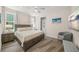 Bedroom with a bed, plank floors and a view to the ensuite bathroom at 340 Avenida De Mayo, Sarasota, FL 34242
