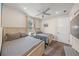 Comfortable bedroom with two twin beds, ceiling fan, and wood-look floors at 340 Avenida De Mayo, Sarasota, FL 34242