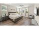 Bedroom with a bed, wood floors and lots of natural light at 340 Avenida De Mayo, Sarasota, FL 34242