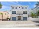 Lovely two-story house, light exterior, a small balcony, and a two-car garage at 340 Avenida De Mayo, Sarasota, FL 34242