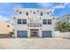 Charming two-story house with a balcony and a two-car garage in a residential neighborhood at 340 Avenida De Mayo, Sarasota, FL 34242