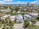 Stunning aerial view of a charming neighborhood near the ocean, showcasing lush greenery and beautiful homes at 340 Avenida De Mayo, Sarasota, FL 34242