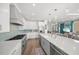Well-lit eat-in kitchen boasts a large island, stainless appliances, and seamless access to living area at 340 Avenida De Mayo, Sarasota, FL 34242