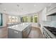 Bright eat-in kitchen features a large island, stainless steel appliances, and an adjacent dining area at 340 Avenida De Mayo, Sarasota, FL 34242