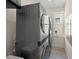 Functional laundry room with stacked washer and dryer units and a window at 340 Avenida De Mayo, Sarasota, FL 34242