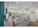 Spacious living room with gray sofa, tile floors, recessed lighting, and open floor plan at 340 Avenida De Mayo, Sarasota, FL 34242