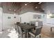 Entertain in the covered outdoor dining area with a wet bar and TV at 340 Avenida De Mayo, Sarasota, FL 34242