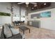 Covered outdoor living area with a wet bar, ceiling fans, and comfortable seating at 340 Avenida De Mayo, Sarasota, FL 34242