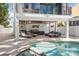 Resort-style backyard featuring a pool, spa, and covered outdoor living area at 340 Avenida De Mayo, Sarasota, FL 34242