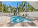 Sparkling pool and spa with tropical landscaping and a privacy fence for relaxation at 340 Avenida De Mayo, Sarasota, FL 34242