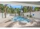 Enjoy the sparkling pool and spa surrounded by lush landscaping and a white fence at 340 Avenida De Mayo, Sarasota, FL 34242