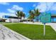 Inviting Siesta Beach public area with palm trees, open lawns, pavilion and modern architectural building at 340 Avenida De Mayo, Sarasota, FL 34242