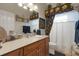 Well-appointed bathroom with wood cabinets, decorative mirror, and neutral tones at 385 165Th Ne Ct, Bradenton, FL 34212