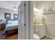 View from bedroom to bathroom with toilet, vanity, decor, and open door at 385 165Th Ne Ct, Bradenton, FL 34212