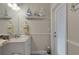 Bathroom with white vanity, nautical decor, and an exterior door at 385 165Th Ne Ct, Bradenton, FL 34212