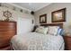 Comfortable nautical-themed bedroom with wooden furnishings and a bright, patterned comforter at 385 165Th Ne Ct, Bradenton, FL 34212