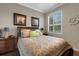 Nautical themed bedroom with a wooden bed frame and window with wooden shutters at 385 165Th Ne Ct, Bradenton, FL 34212
