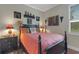 Comfortable bedroom with natural light, stylish decor, and a cozy ambiance at 385 165Th Ne Ct, Bradenton, FL 34212