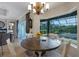 Bright dining area with large windows overlooking the pool and backyard offers the perfect view at 385 165Th Ne Ct, Bradenton, FL 34212
