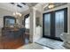 Elegant foyer features a decorative front door, coffered ceiling and opens to the dining room at 385 165Th Ne Ct, Bradenton, FL 34212