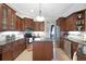 Well-equipped kitchen with granite countertops, stainless steel appliances, and dark cabinets at 385 165Th Ne Ct, Bradenton, FL 34212