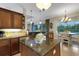 Beautiful kitchen featuring a kitchen island, granite countertops, and stainless steel appliances at 385 165Th Ne Ct, Bradenton, FL 34212