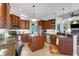 Spacious kitchen with stainless steel appliances, granite countertops, and dark wood cabinetry at 385 165Th Ne Ct, Bradenton, FL 34212