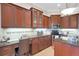 Eat-in kitchen boasts workspace, granite countertops, tile backsplash, and stainless steel appliances at 385 165Th Ne Ct, Bradenton, FL 34212