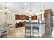 Gourmet kitchen with ample counter space perfect for entertaining guests with an adjacent seating area at 385 165Th Ne Ct, Bradenton, FL 34212