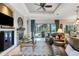 Relaxing living room with fireplace, large windows, and comfortable seating at 385 165Th Ne Ct, Bradenton, FL 34212