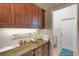 Office area features granite countertop, wooden cabinets, and easy access to laundry at 385 165Th Ne Ct, Bradenton, FL 34212