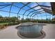 Inviting screened pool with a built-in spa and lush landscaping at 385 165Th Ne Ct, Bradenton, FL 34212