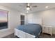 Cozy bedroom with a beach view and a comfortable queen-sized bed, a ceiling fan and a nightstand at 4200 Gulf Dr # 104, Holmes Beach, FL 34217