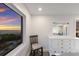 Bedroom view from the window, capturing a picturesque beach sunset and adjacent view reflected in a mirror at 4200 Gulf Dr # 104, Holmes Beach, FL 34217
