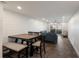 Dining area with an adjacent seating area and view to the outdoors, creating a spacious living area at 4200 Gulf Dr # 104, Holmes Beach, FL 34217