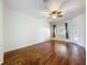 Bedroom with natural light, hardwood floors, and a ceiling fan at 4239 Corso Venetia Blvd, Venice, FL 34293