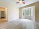 Bright bedroom with a bay window and ceiling fan, offering ample natural light at 4239 Corso Venetia Blvd, Venice, FL 34293
