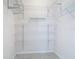 Walk in closet with wire shelving and laminate flooring at 4239 Corso Venetia Blvd, Venice, FL 34293