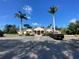 Community clubhouse features a porte cochere, accessible parking and landscaping at 4239 Corso Venetia Blvd, Venice, FL 34293